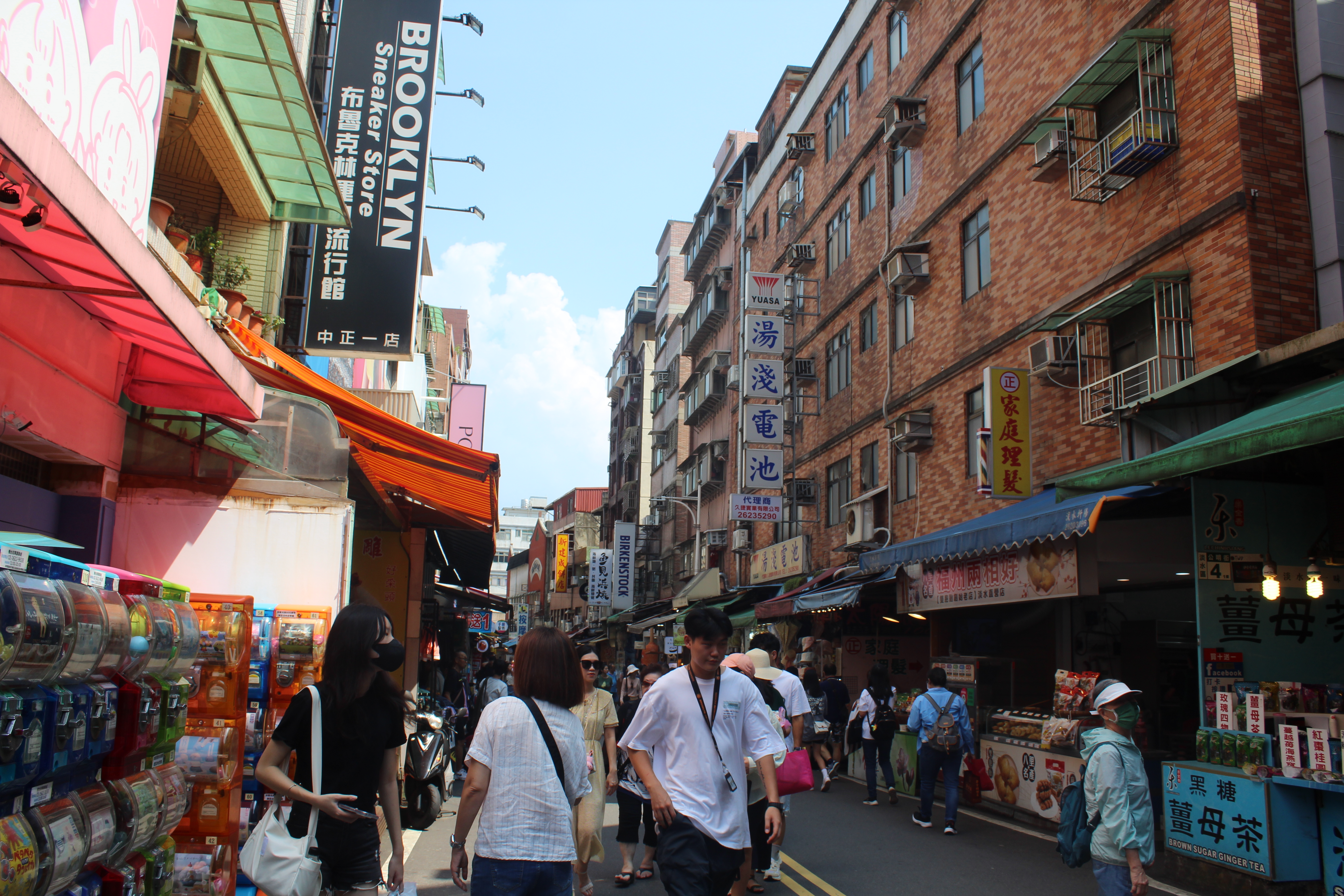 Bustling street scene in Taiwan with Chinese signage